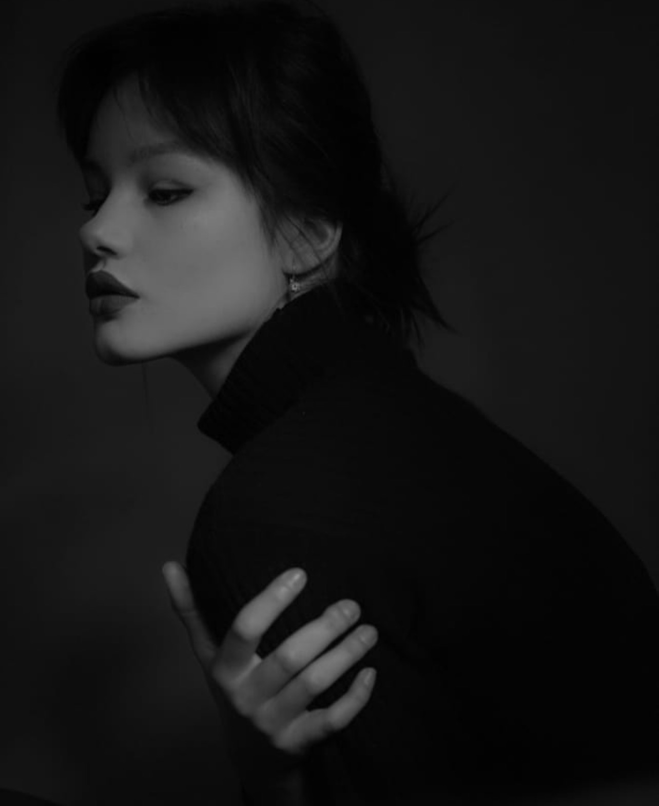 Black and white cinematic portrait of Emilia Crusninschi, Romanian film director and model
